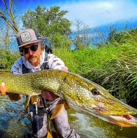 FlyFishFinder Person Holding big fish