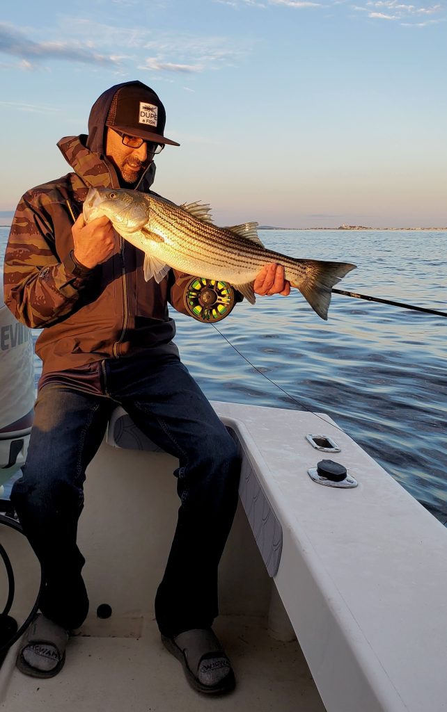 FlyFishFinder Person holding fish